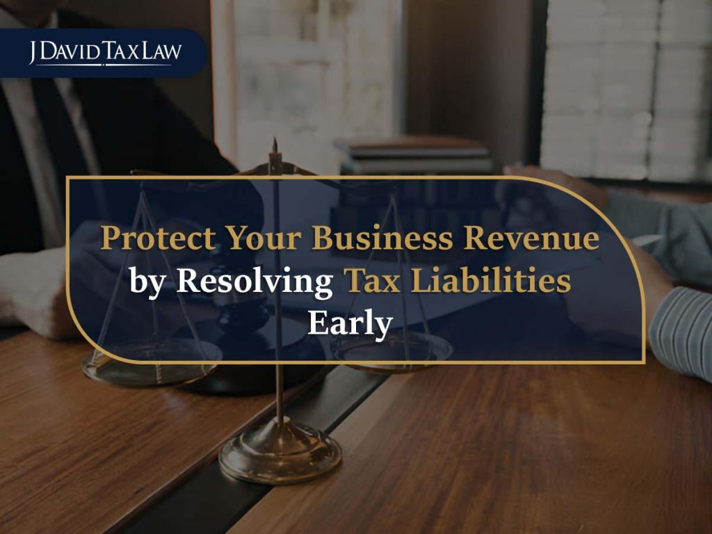 Individual reviewing tax documents at home, highlighting the stress of tax debt and IRS notices